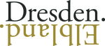 Das Bild zeigt ein schwarz-goldenes Logo. In der ersten Zeile steht in schwarz das Wort Dresden. Darunter in Spiegelschrift das Wort Elbland.